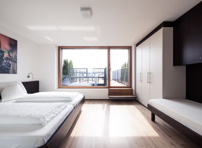 Bedroom with roof terrace in the Villa Pernstich in Caldaro - view over Lake Caldaro